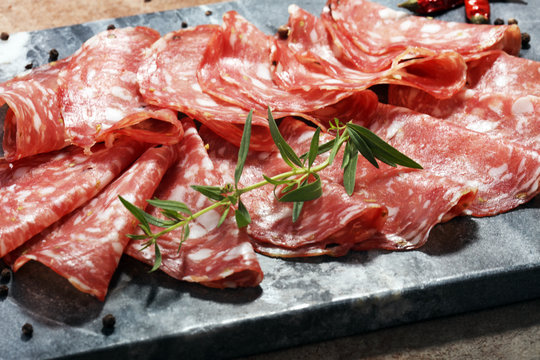 thinly sliced salami . delicious snack rustic salami