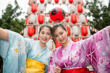 Asian young ladies holding hands together