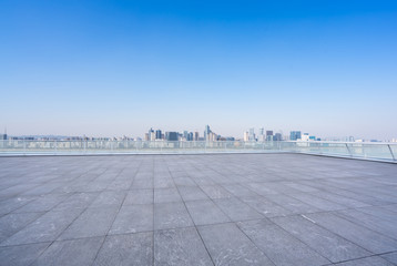 Fototapeta na wymiar empty square with panoramic city skyline