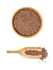 Linseed or flax seed in a wooden bowl and a spoon under it seen from above isolated on white background