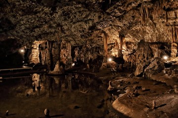 Fototapeta na wymiar Stalagmites and stalactites inside the big cave dome