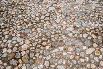 Texture of the surface paved with stones.
