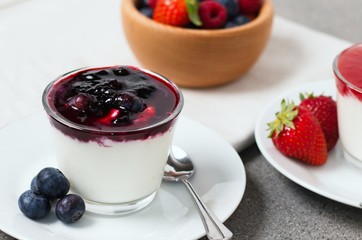 Fresh summer snack of yogurt with forest fruits
