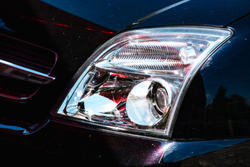 Close up headlights of the car. Exterior detail.
