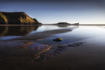 Blue hour at Worms Head on the Gower peninsula in Swansea, South Wales, UK
