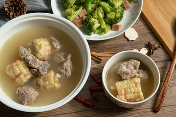 Bone soup with wood grain background