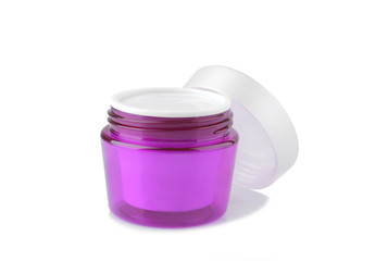 Face cream in a lavender jar with a white lid on a white background. isolated