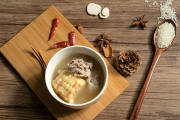 Bone soup with wood grain background
