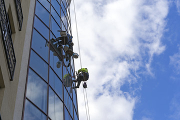 Wash Windows in high-rise buildings offices, glass cleaning service