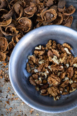 Walnuts kernels with color background, Whole walnut in a metal plate. Walnuts. Walnuts an market. Background of walnuts. Healthy.