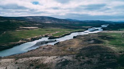 aerial view of river in iceland with light blue water