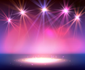 Spotlight on stage with smoke and light.