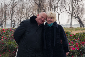 Adult european happy smiling couple in spring park