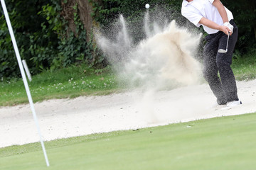 A golf player on a green