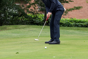 Fototapeta premium A golf player on a green