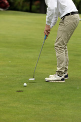 Fototapeta na wymiar A golf player on a green