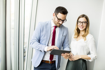 Businessman presenting business data on digital tablet at office