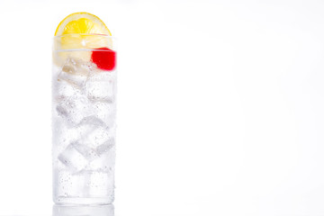 Classic Tom Collins cocktail on white background. Copyspace

