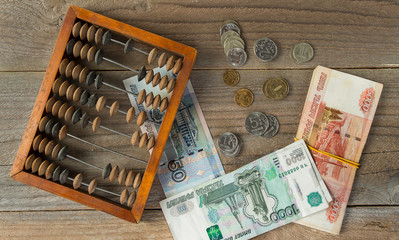 Vintage wooden abacus and Russian money: coins and banknotes