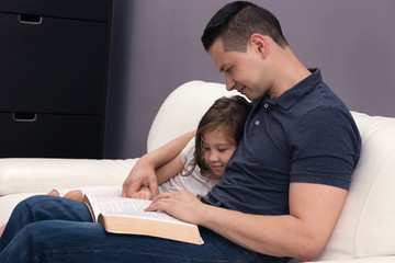 Father and Daughter Reading the Bible
