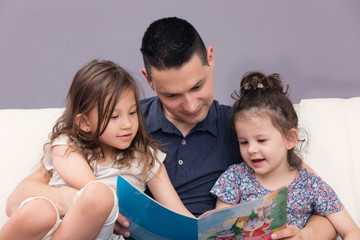 Father Reading His Daughters Stories