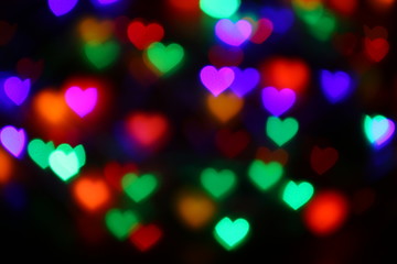 Valentines Colorful heart-shaped bokeh on black background lighting bokeh for decoration at night backdrop wallpaper blur valentine, Love Pictures background, Lighting heart shaped soft night abstract