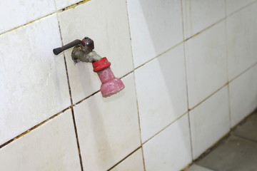 old water tap in bathroom old faucet on a bathroom wall