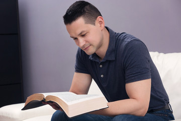 Man Reading the Holy Bible