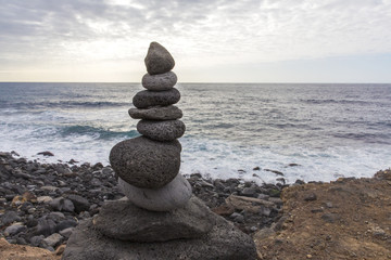 Puerto de la Cruz. Stone piles ( Cairns) on Playa Jardin, Peurto de la Cruz, Tenerife, Canary Islands, Spain. Selfmade rock-monument at the beach of Puerto de la Cruz Tenerife.