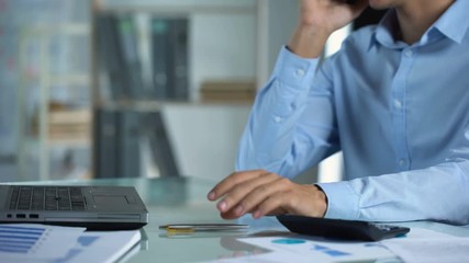 Male office worker talking on phone, appointing meeting with client, occupation