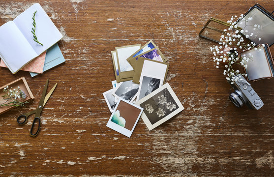 creative workspace photographer sorting vintage pictures