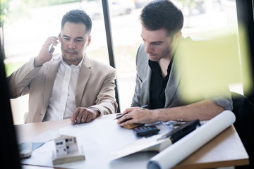 Business partners showing team work while working in meeting room at office interior Business consultant concept. Team work and successful project.