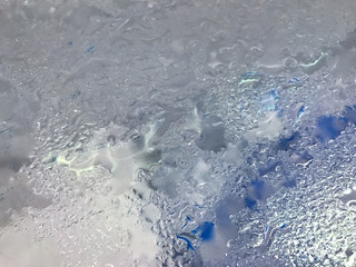 Top view of Mirror glass the dump ice bucket with water steam bubble drop wet condensation