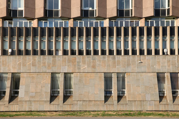 Fototapeta na wymiar stone wall of a building with a windows