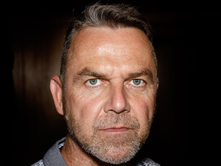 Attractive middle-aged man with a stubble beard