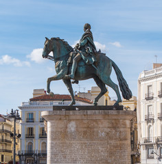 Monument and statue of King Carlos at Puerta del Sol Square in Madrid