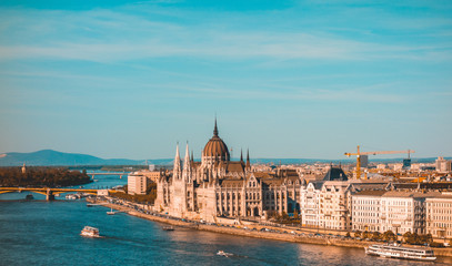 parliament at budapest with danube river and cityscape background