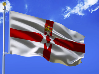 Northern Ireland flag Silk waving flag with emblem hand in the six pointed star with crown of Northern Ireland with a flagpole on a sunny blue sky background with white clouds 3D illustration.