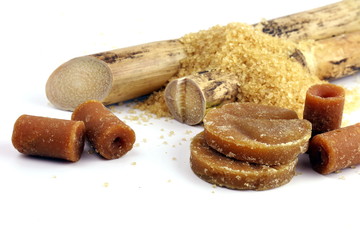 Sugar cane and pile Granulated Sugar reed solid, Cane, Sugar reed solid concentrate, Sugar cubes brown from Sugarcane and various kinds of sugar brown cubes round sphere on white background