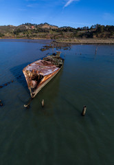 Fototapeta na wymiar Shipwrecked old Rusted Boat in Richmond CA