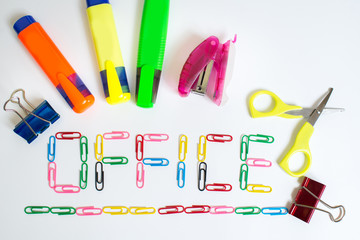 Word OFFICE from colored paper clips on white
