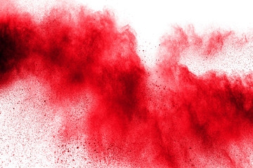 abstract red dust splattered on  white background. Red powder explosion.Freeze motion of red...