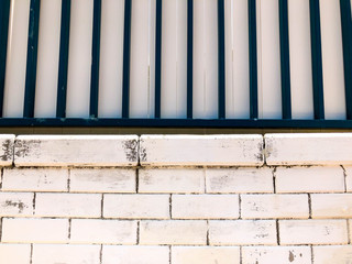 White bricks form a painted white brick wall