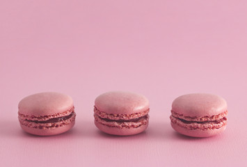 Pink French Macarons on a Pink Background