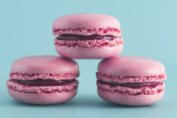 Pink French Macarons on a Blue Background