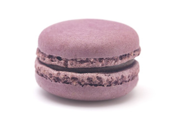 Obraz na płótnie Canvas Single Purple French Macarons on a White Background