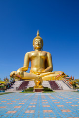 Golden Buddha with clear sky background at Thailand