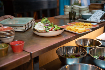 breakfast in the restaurant buffet. fries and salad
