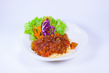 Macaroni noodles with tomato cheese serve on white dish and vegetable 