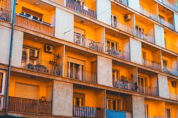 Fototapeta na wymiar colorful orange balcony with white details